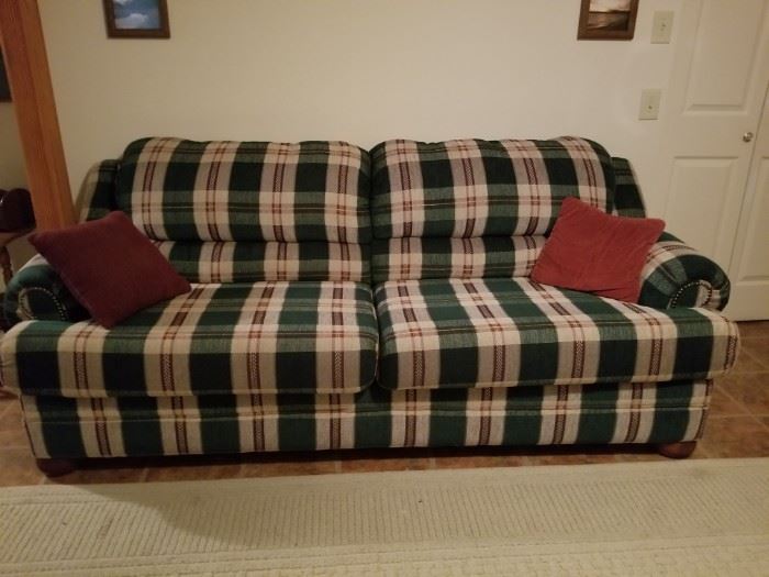 Green plaid couch with rollout pull out bed. SOFABED.