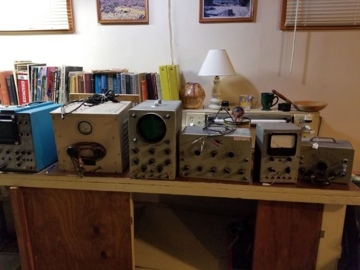 Large collection of ham radio testing equipment.