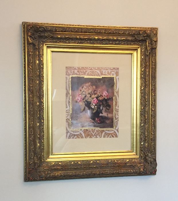 One of two large ornately framed floral prints