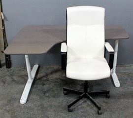 IKEA L-Shaped Sales Table/Desk Adjustable Height x 63"L x 43.5"D With Black And White Leather Style Rolling Chair