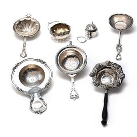 collection of sterling tea strainers and infuser