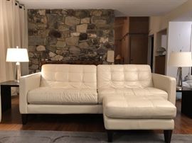 Macy's pearl-color, Italian-leather sofa and ottoman, and two Pottery Barn Bancroft crystal rheostat bedside lamps