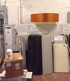 Industrial metal gondola shelvings, revolving accessory towers,styrofoam hat heads, giant  ceiling fixture lampshade