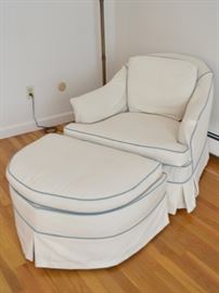Slip covered chair with ottoman