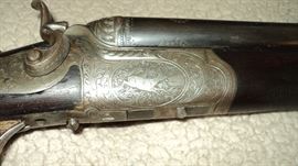 1920 German Drilling Gun   Side by Side 16 gauge shotgun with a 8 mm Rifle barrel underneath.  Engraved beautifully!