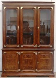 Brass adorned china cabinet