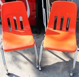 Pair orange molded chairs