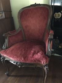 Red velvet carved armchair in the style of king Louis XiV