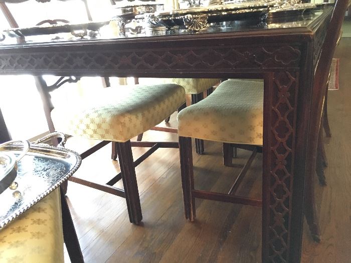 Detail: Chinese Chippendale extension table with two leaves, believed to be by Kittenger shown with George III ladder-back chairs