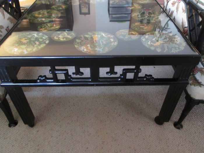Lacquered Asian-Style Coffee Table on Casters with Side-Carved Details, 36" X 36".  Beautiful Inlayed Discs in Various Hunting Scenes Decorate the Table Top.  There is also a Glass Top Insert.