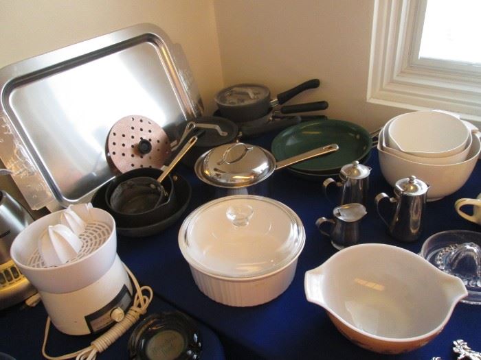 Pots & Pans, Stainless Creamers, Covered Ovenware.    Vintage Aluminum Tray on the back left of table is by Kensington.  The Handles have Etched Ships and a Whale