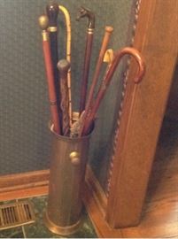  Brass cane stand and vintage canes. Individual pictures to fallow 