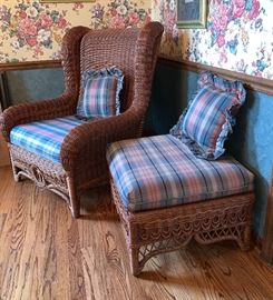  One of two matching wicker chairs with ottoman 