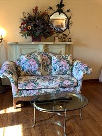  Floral loveseat and small brass coffee table with glass top 