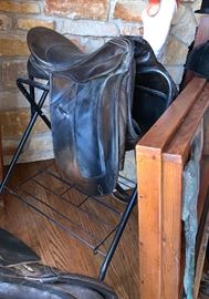 Metal saddle holder and black leather saddle 