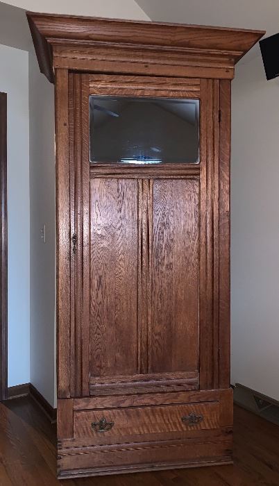 Stunning, tall,  thin armoire with mirror. 