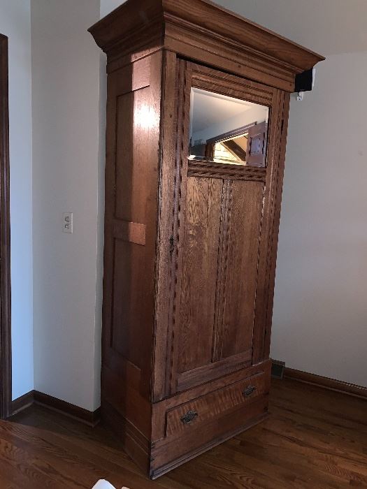 Stunning, tall,  thin armoire with mirror. 