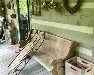 vintage sled, old church pew, wood crates