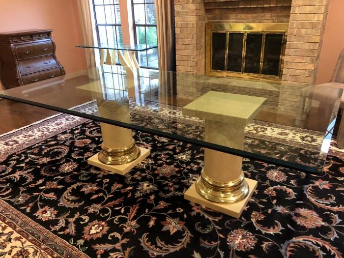 Fabulous 8' long glass top dining table with double column pedestal base and custom pad covers.