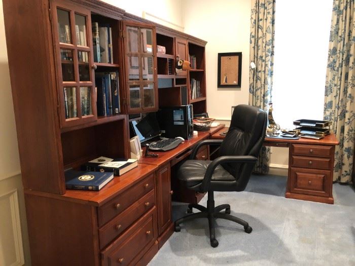 Three-section office suite with plenty of desk space, shelving, drawers, keyboard pull-out and more from Louis Shanks Fine Home Furnishings.