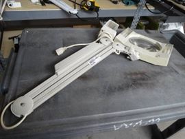 Magnifying shop light.