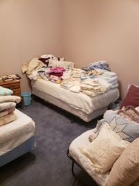 several rooms full of linens, towels, blankets, QUILTS,  comforters, pillows, throw rugs and full-size room rugs