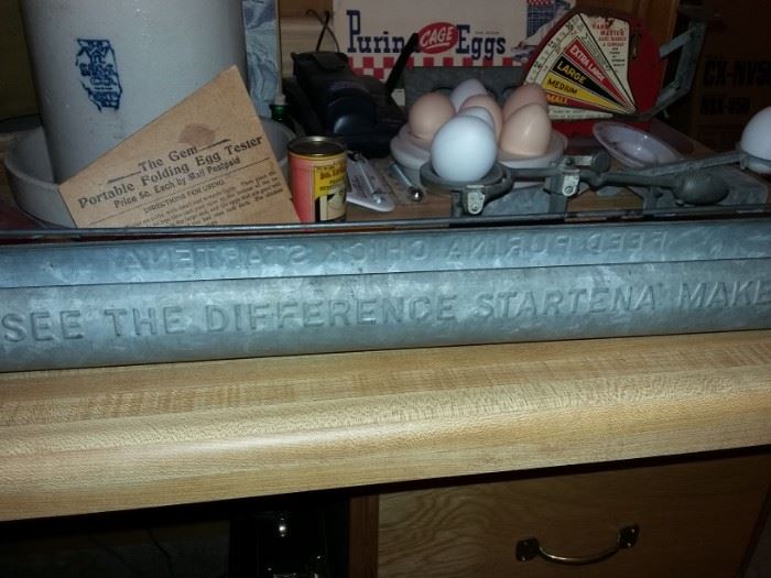 Advertising "See the difference Startena makes!" galvanized poultry feeder