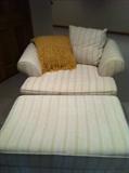 Oversized upholstered chair and ottoman.