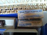 Antique Train cars with boxes.