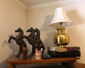 3 horses doing the macarena, brass lamp