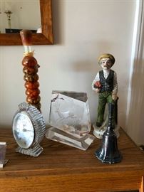 Crystal clock, paper weight, ceramic fisherman who is the father of a feisty daughter who wants to man her own ship