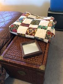Handsewn quilt, rattan chest