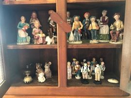 Miniature people trapped in a cabinet with rates! Set them free!