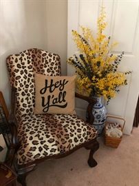 leopard taxidermied into the shape of a chaire