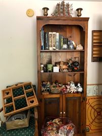 bookshelf filled with things -- don't look too close at that bobble-head doll on the right on the second shelf because nope nope nope 