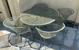 Vintage Wrought Iron Mesh Patio Table w/ 4 Chairs	29 x 42in diameter	