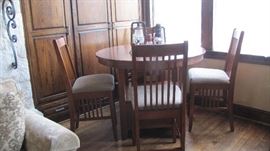 High top table with 4 Chairs.  Table has storage drawer 