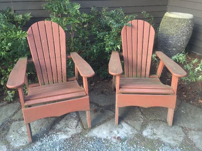 Pair of Adirondack chairs (painted wood), large pot in back corner