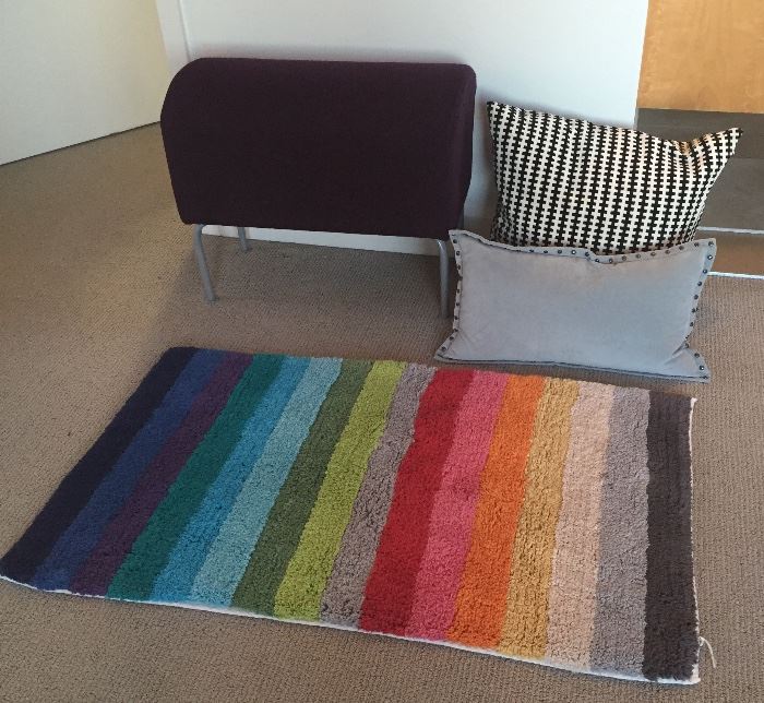 Purple IKEA wool stool/bench, throw pillows, Company Store bath rug
