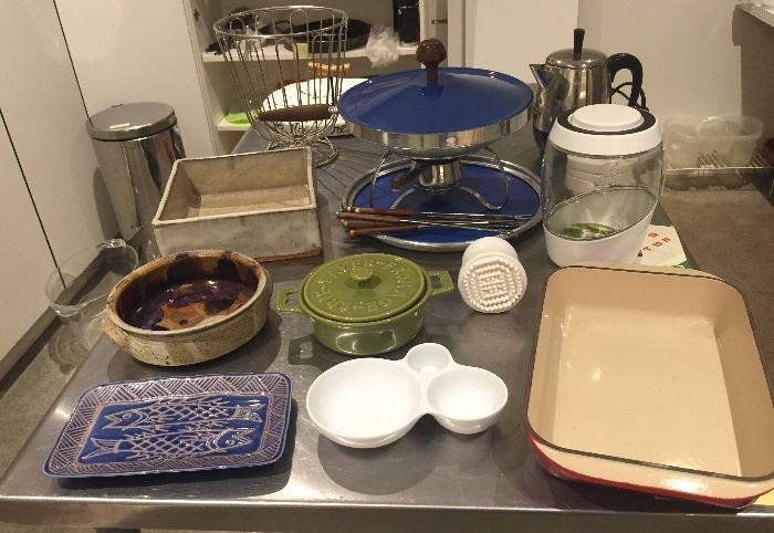 Pottery serving pieces,  Le Creuset #30 orange baking dish, blue chafing dish with fondue forks, Mortier Pilon fermenting jar, Farberware electric percolator