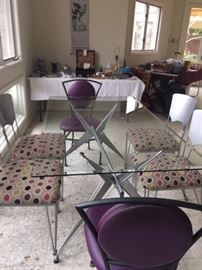 Contemporary glass table with six chairs.