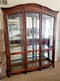 Curio cabinet with three doors. (one side is unhinged)