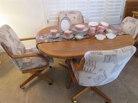 Dinette Table/4-Chairs on Casters with 1-18" Leaf.       Southwest Style Upholstery, 42" X 54"