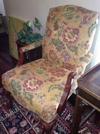 One of two matching upholstered arm chairs
