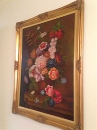 An additional floral framed piece of art