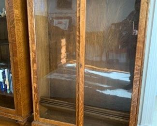 Double glass door bookcase clawfoot with tiger oak