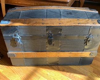 Antique steamer trunk with metal tooling