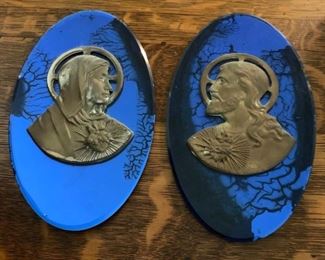 Oval blue mirrored plaques with medallion figurine overlays