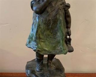 Bronze statue of girl standing on chair signed Juan Clara 