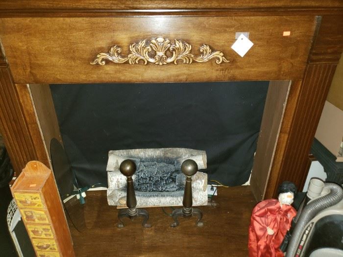 Fireplace mantle with electric logs. No heat, just looks!
